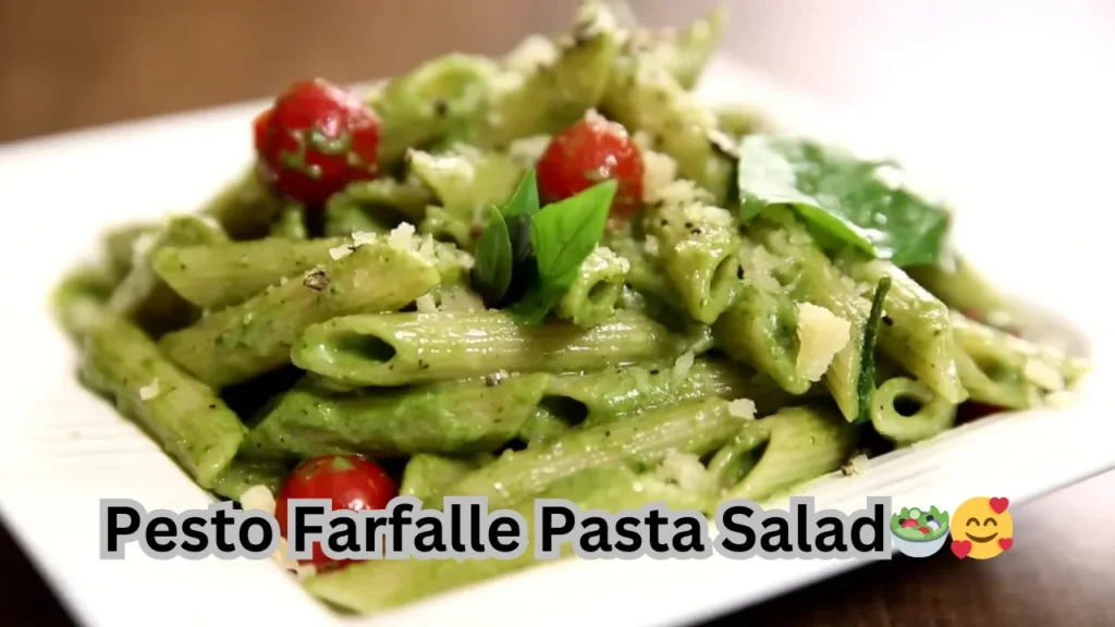A serving of pesto farfalle pasta salad, showcasing bowtie pasta, green pesto, and assorted chopped vegetables.