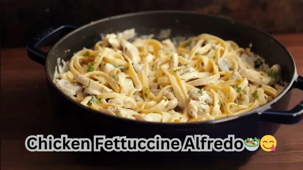 A delicious plate of chicken fettuccine alfredo, featuring tender pasta, creamy sauce, and a sprinkle of herbs.