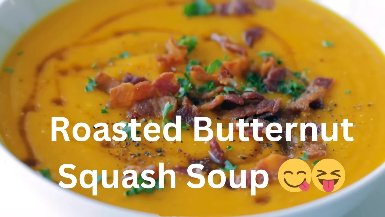 Creamy roasted butternut squash soup garnished with a sprinkle of herbs and a drizzle of olive oil in a rustic bowl.