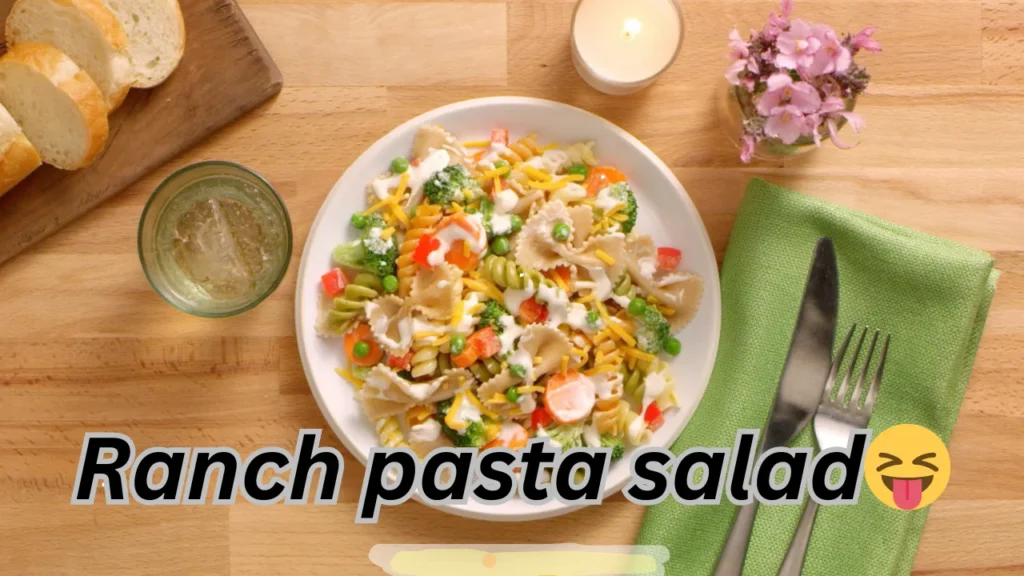 a delicious ranch pasta salad, highlighting pasta, fresh veggies, and a rich dressing in a bowl.
