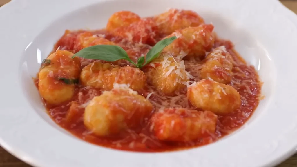 Gnocchi with tomato sauce 2 A delicious serving of gnocchi with tomato sauce, perfect for pasta or as a savory dip.