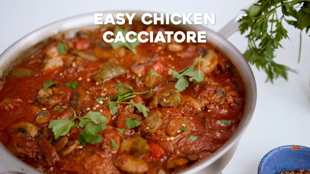A delicious plate of easy chicken cacciatore, featuring tender chicken, bell peppers, and a rich tomato sauce.