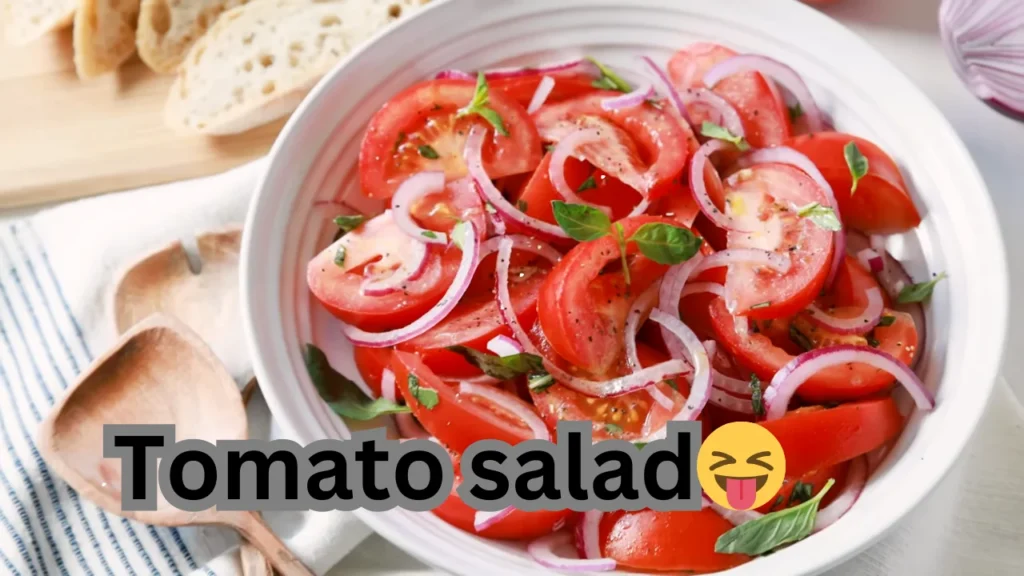 A fresh tomato salad in a bowl, showcasing juicy tomatoes, white onions, and red onions for added flavor.