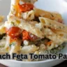 Spinach feta tomato pasta served in a bowl, showcasing vibrant colors and fresh ingredients.