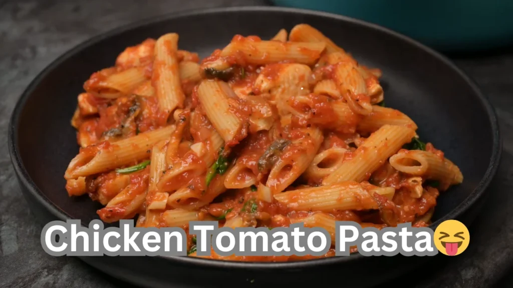A mouthwatering chicken tomato pasta showcasing juicy chicken and fresh tomatoes in a rich, flavorful dish.